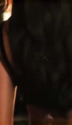 Busty Brunette in Sparkly Bikini Struts Seductively on Sunset Runway