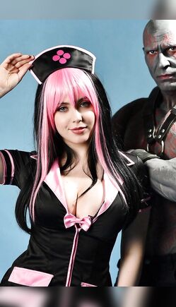 Cosplay Nurse Meets Armored Warrior in Studio Fantasy Scene