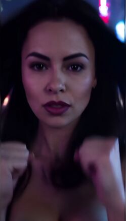 Brunette Singer in Black Bra Performs Energetic Mic Tease