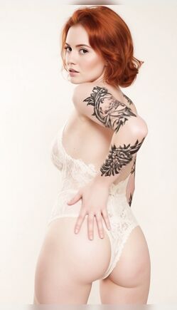 Redhead Model In Sheer Bodysuit Studio Posing