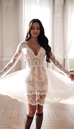 Brunette Spins In White Lace Dress Inside Sunlit Studio