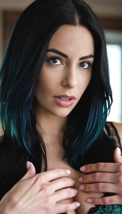 Raven-Haired Beauty In Teal Lingerie Tempts The Camera